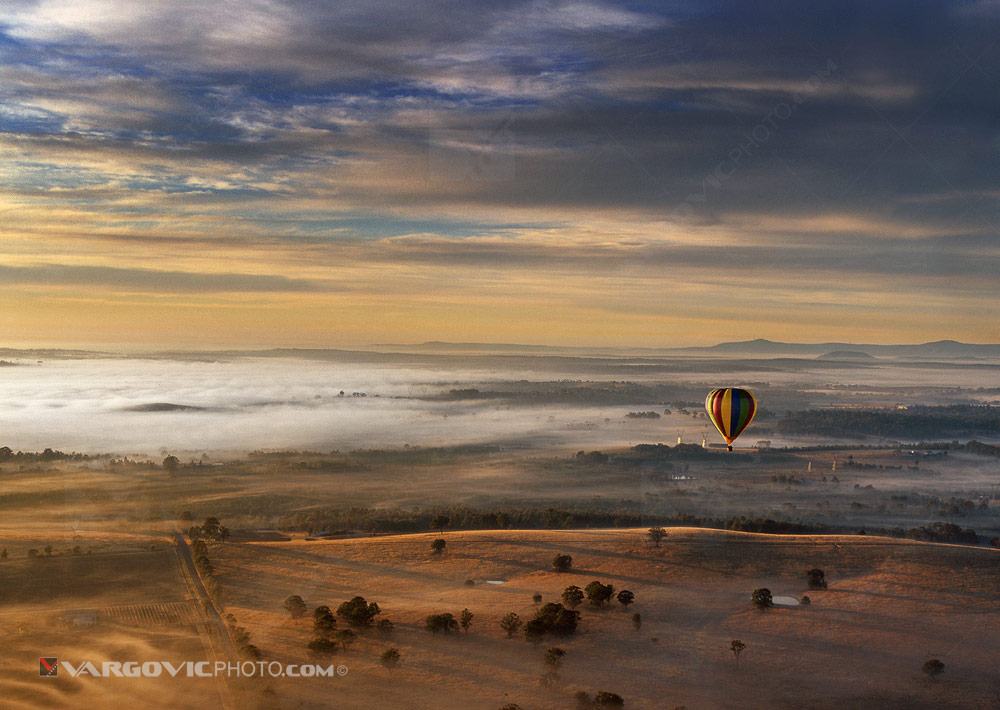 Magnificent foggy morning balloon winter flight above Australian wine-growing areas Hunter Valley near to town Cessnock in the state of New South Wales